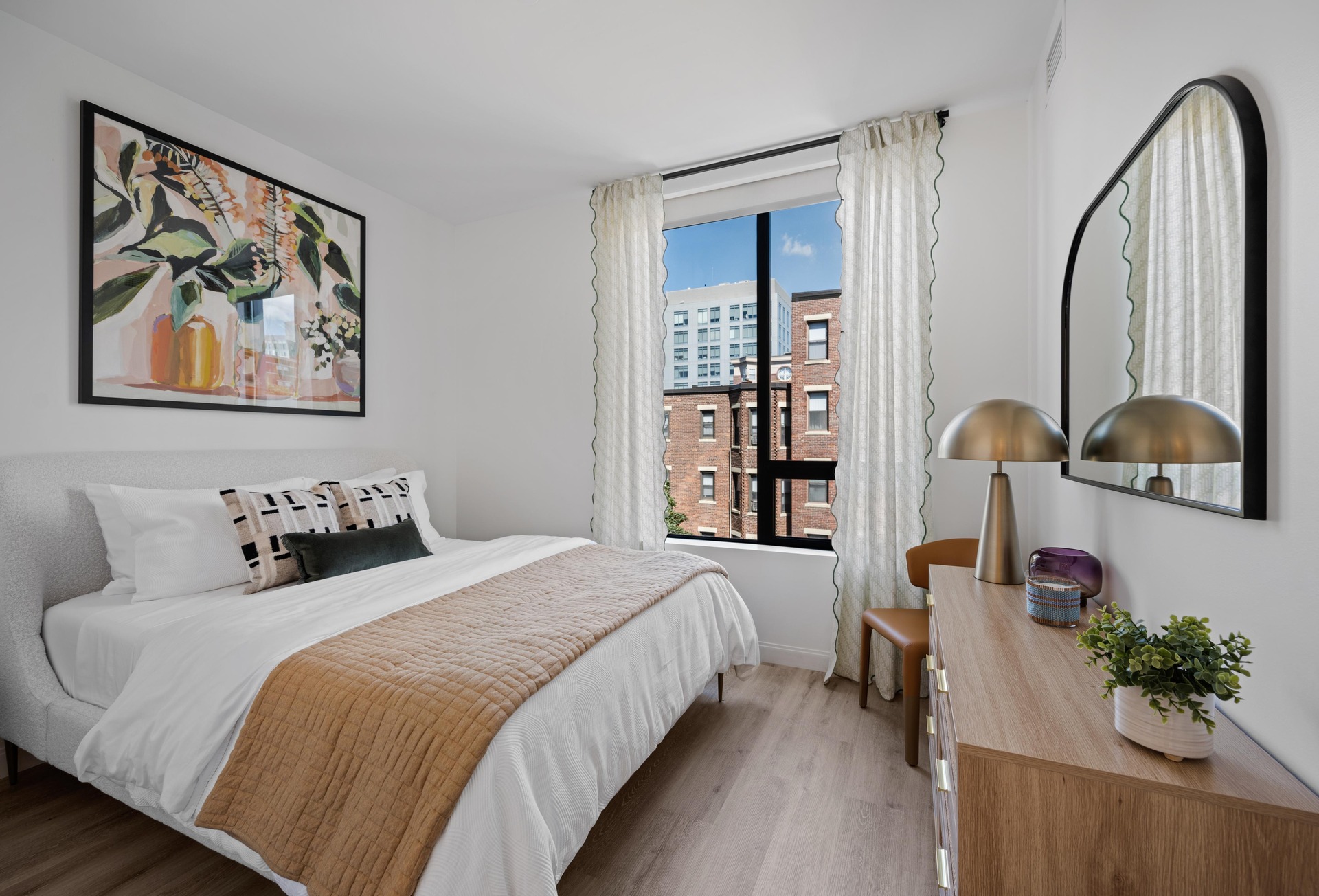 Primary bedroom with a window view.