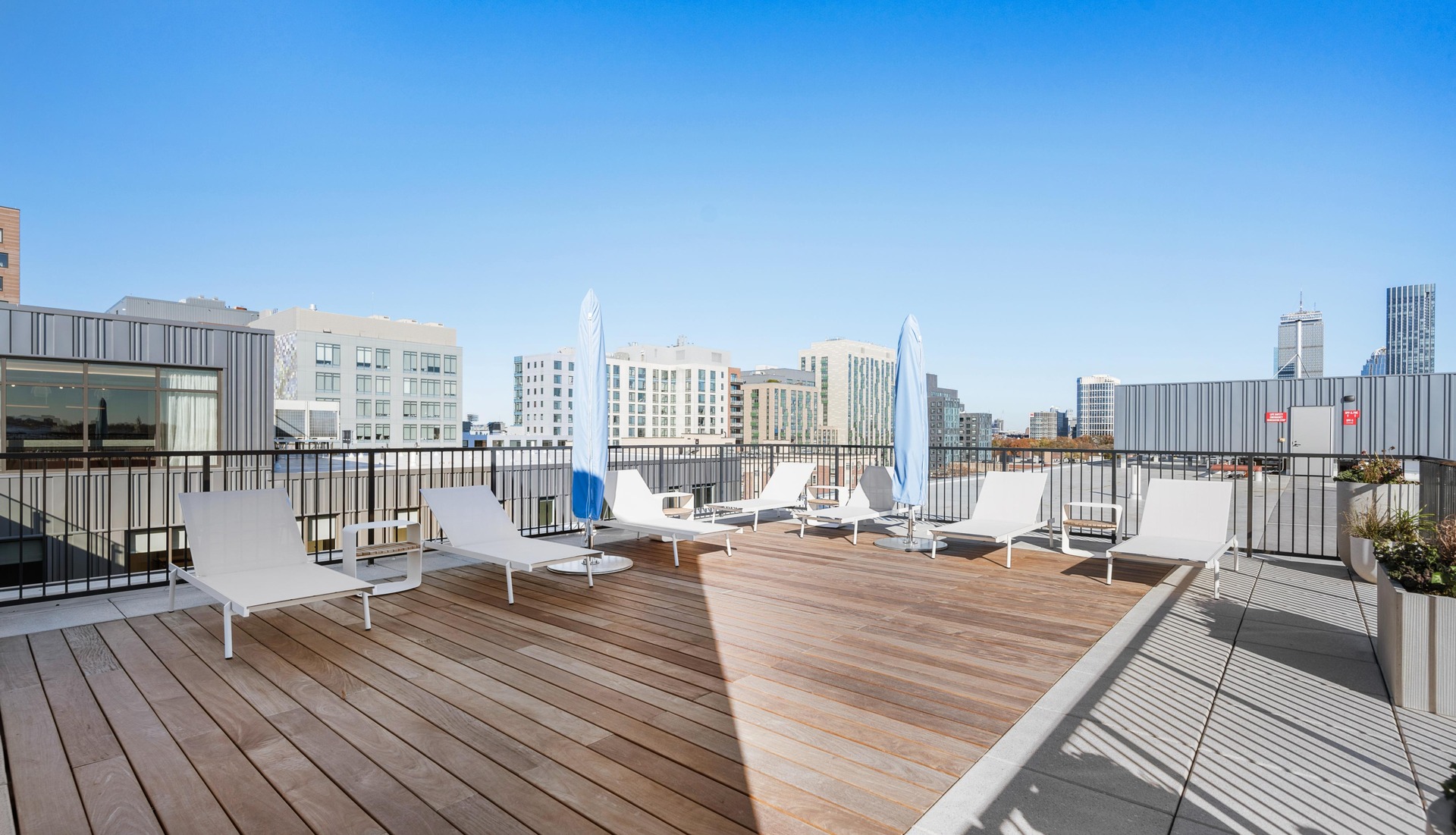 Cozy rooftop sectional seating with friends.